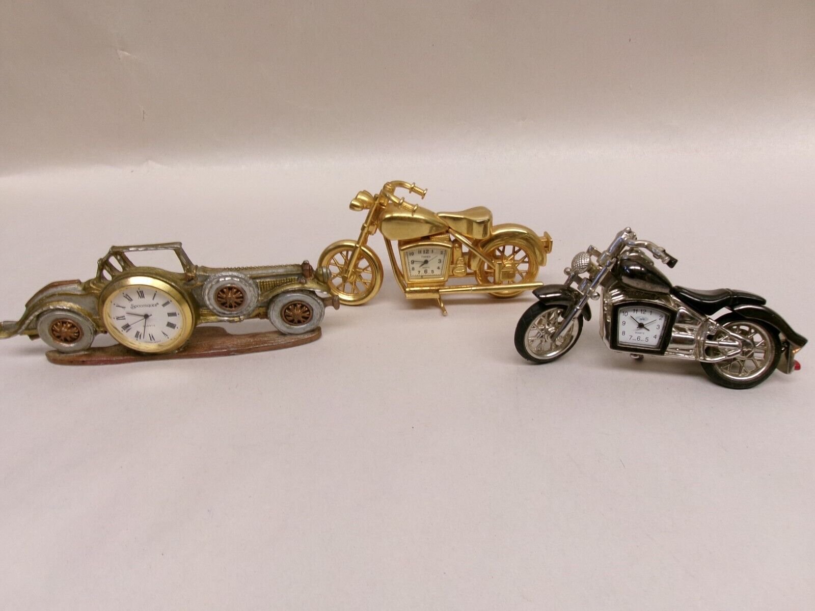 3 DECORATIVE TABLE TOP CLOCKS....MOTORCYCLES....CAR......UNTESTED
