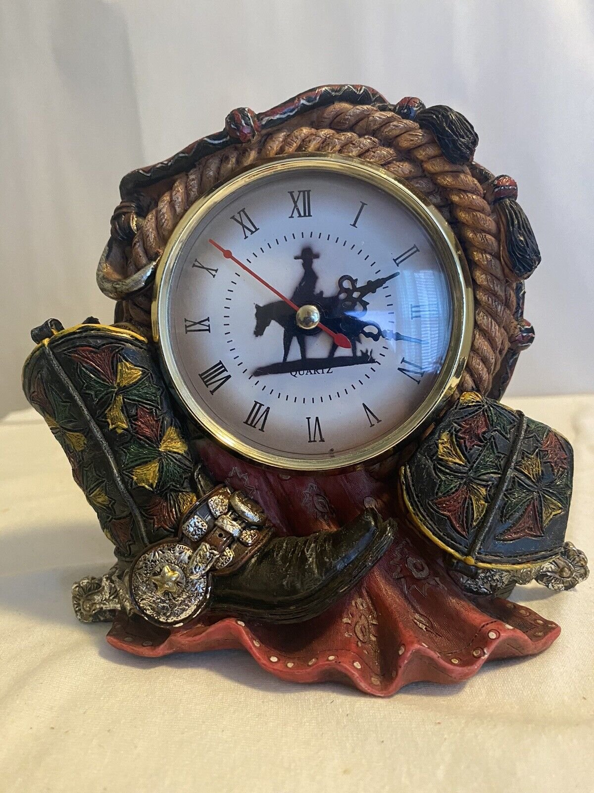 A beautiful cowboy rodeo desktop clock very nice design used but working good.