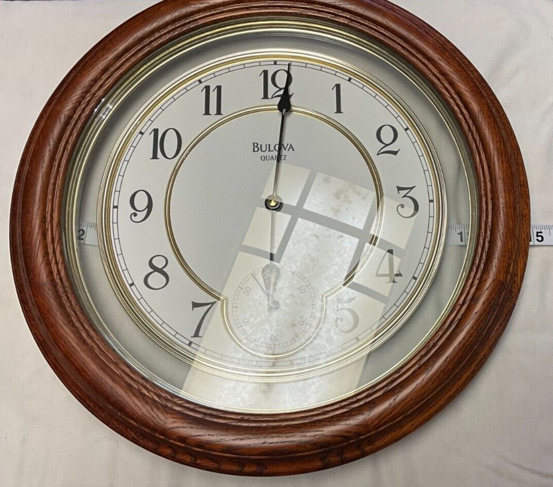 Bulova wooden wall clock with desirable sub second dial, rarely used if ever