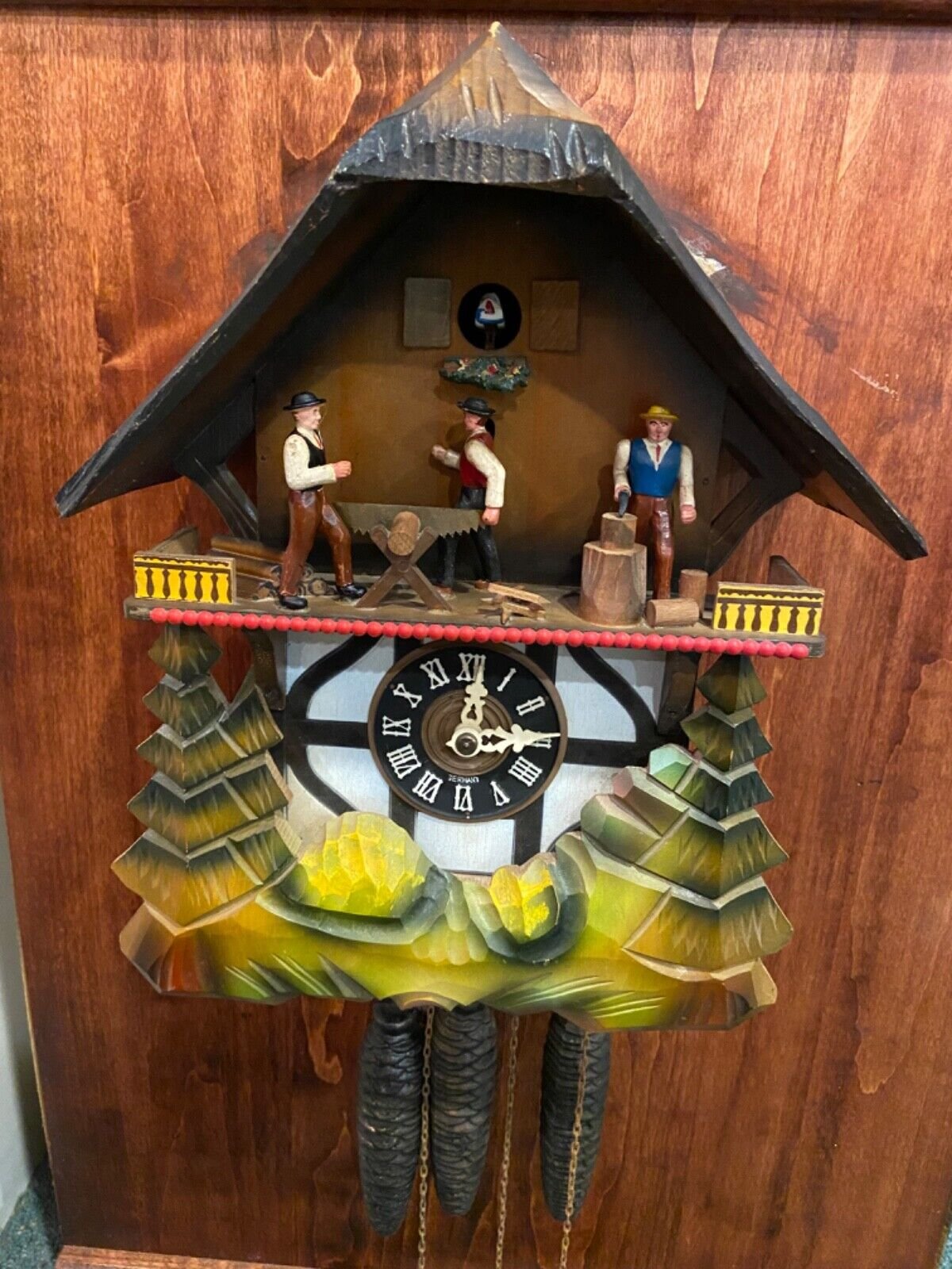 Vintage Black Forest GERMAN MUSICAL Cuckoo Clock w Men Chopping. Sawing