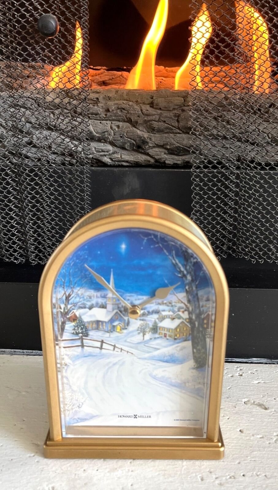 Howard Miller Silent Night Gold Arched Clock With Winter Scene Quartz Movement M