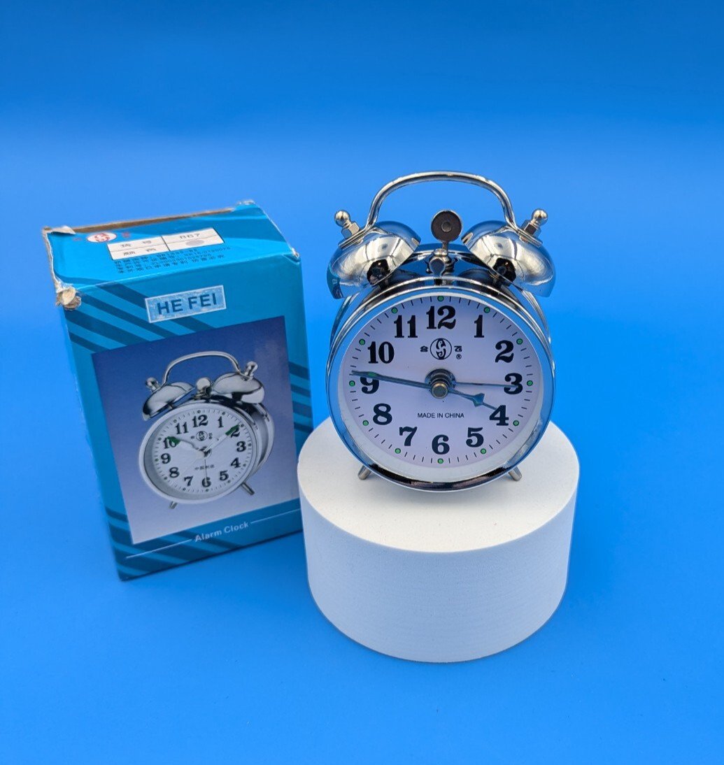 Chrome Silver Old Fashioned Wind up alarm clock by He Fei No Batteries