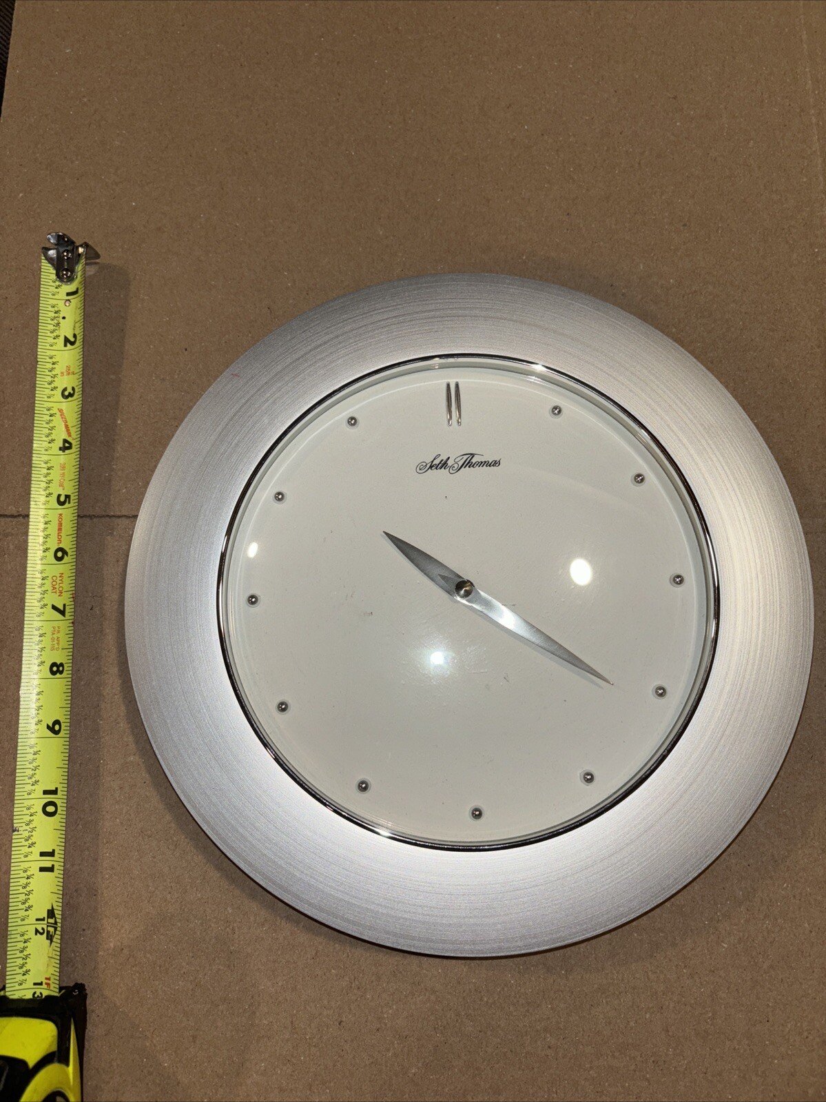 SETH THOMAS QUARTZ WALL CLOCK. Silver Color With White Background.