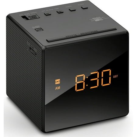 4-inch Black Alarm Clock Radio - AM/FM Tuner, LCD Display, Snooze, Automatic DST Adjustment, Compact Design