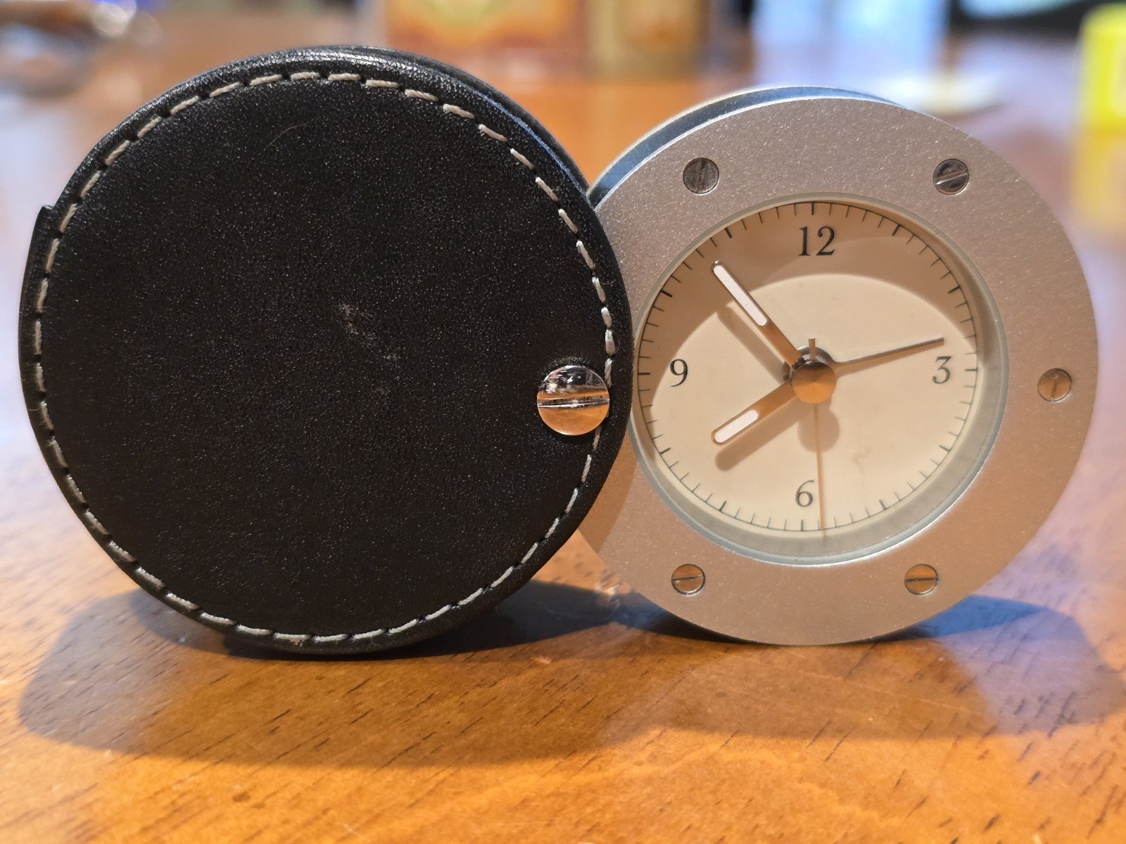 Sharper image travel alarm clock. Leather And Brushed Aluminum. Excellent Works