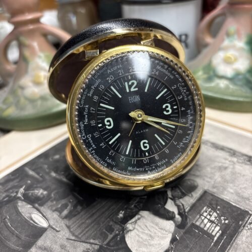1970’s ELGIN Windup Travel Alarm Clock Black Face Luminous World Time Desk Clock