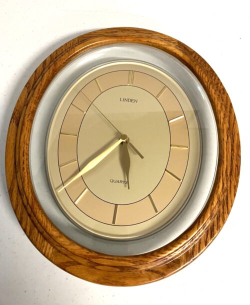 Beautiful Linden Quartz Oval Wall Clock, 12.5" x 11" Keeps time well, wood/glass