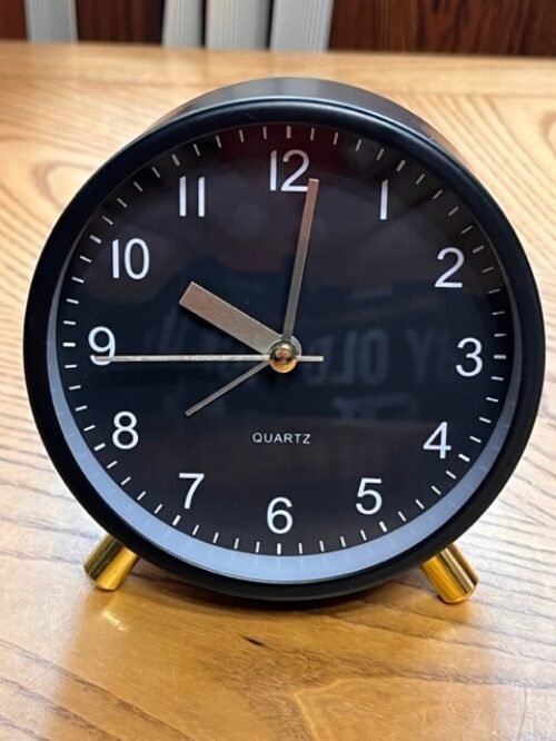 BLACK BATTERY OPERATED ALARM CLOCK IN THE THE BOX TESTED AND WORKS