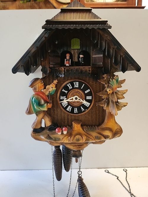 black forest german large cuckoo clock with music and dancers image