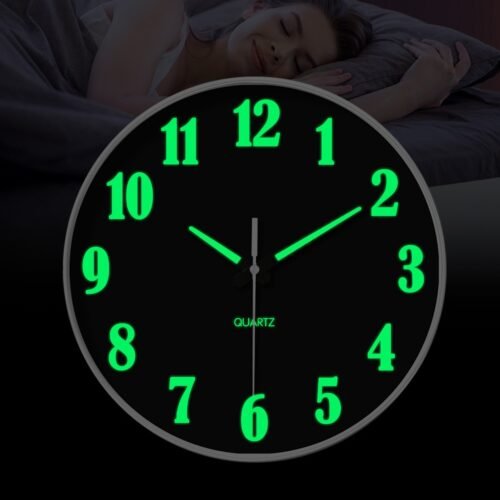 Black plastic luminous wall clock, battery powered, round, silent quartz clock.