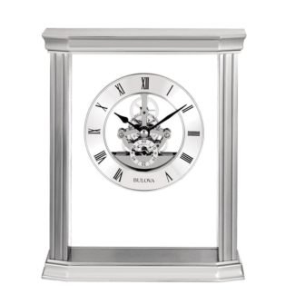 Cafe Skeleton table clock in silver with glass accents. Quartz movement and...