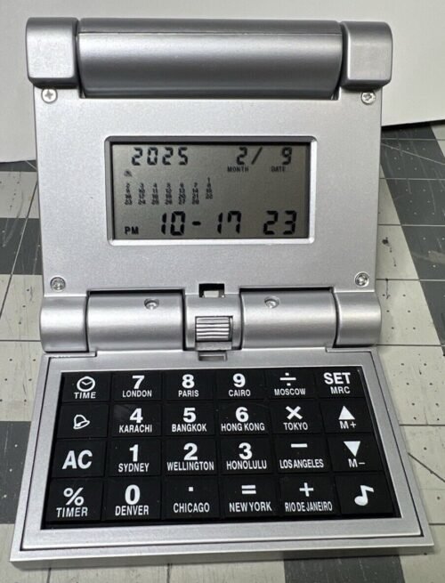 Collapsible Travel Alarm clock, calculator, world time, calendar, 3.5” Folded