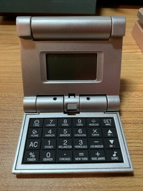 Collapsible Travel Alarm clock, calculator, world time, calendar, 3.5” Folded