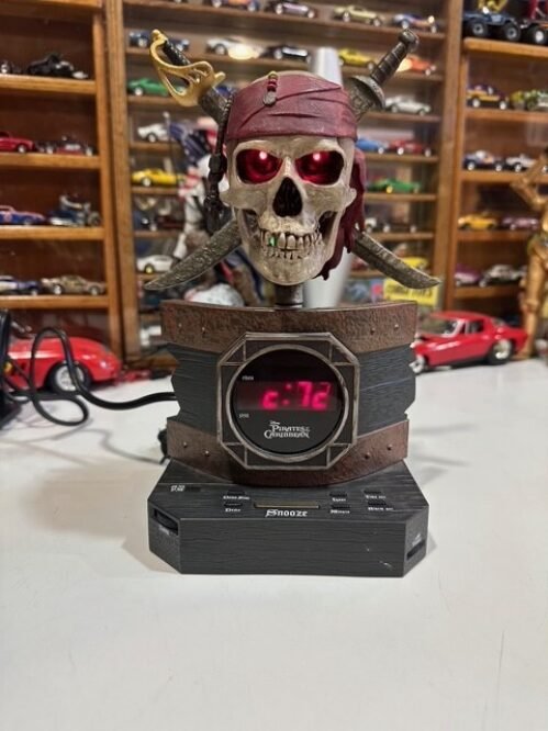 Disney Pirates of the Caribbean Alarm Clock Radio Skull Swords Pre-Owned