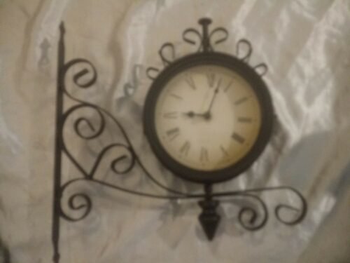 DOUBLE SIDED WALL CLOCK HANGS SIDEWAYS BLACK / METAL ROMAN NUMERALS