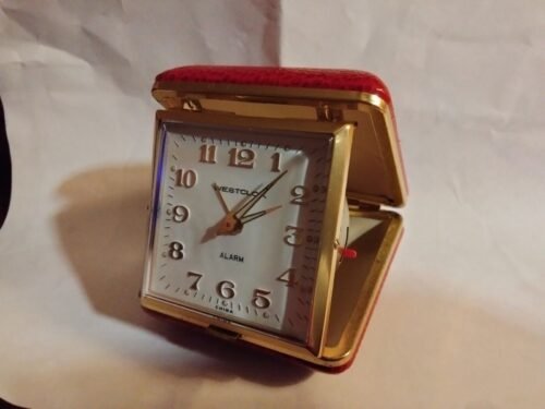 Equity red sqaure travel alarm clock, manual wind-up, gold trim, works good