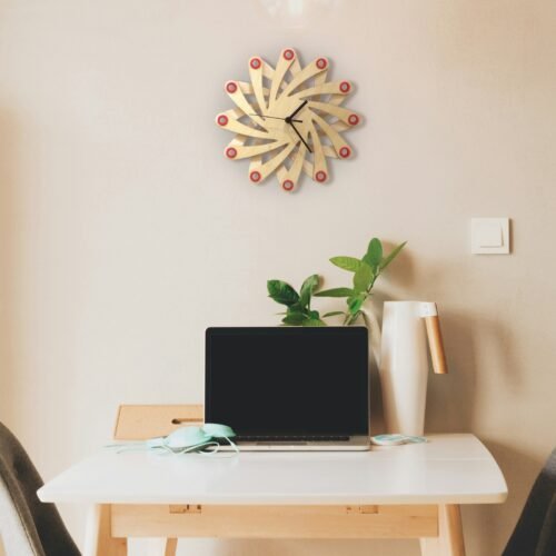 Galaxy red - star shaped wall clock made of bent plywood
