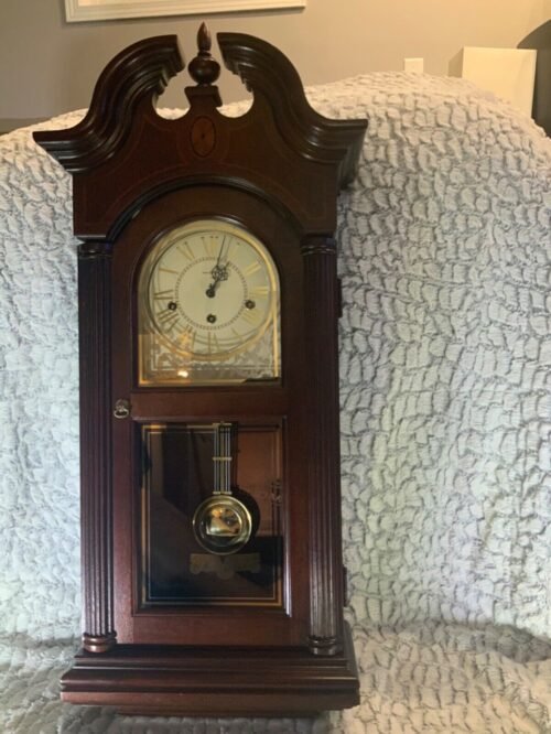 Howard Miller Wall Clock 612-215; 32”; Key Wind, Triple Chime, Mahogany w/inlay