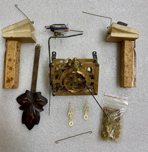 Japanese Cuckoo Clock Movement With Hands, Pendulum, Bellows, Chains, And Bird