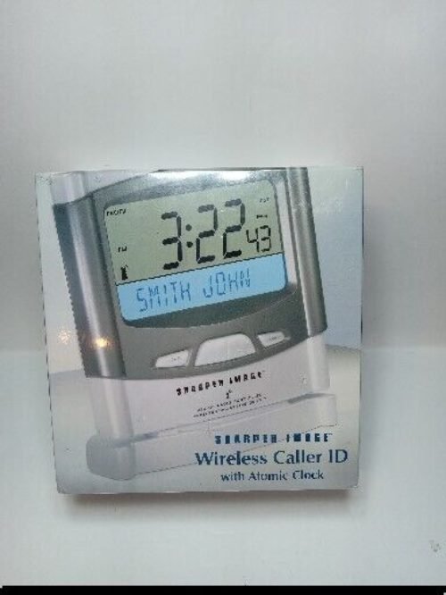 New In sealed Box Sharper Image Wireless Caller ID with Atomic Clock