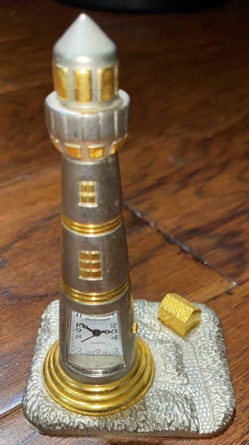 Platinum Lighthouse Desk Clock Gold Tone Quartz Japan, 2002 Kenedy Space Center