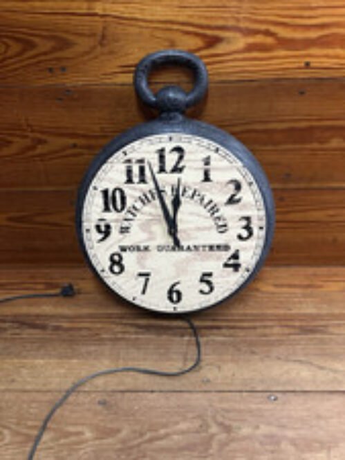 Pocket-Watch-Shaped wall Clock: "Watches Repaired-Work Guaranteed;" works