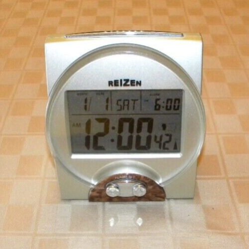 REIZEN TALKING DIGITAL ALARM CLOCK -- AUDIBLE AND VISUAL TIME DISPLAYED