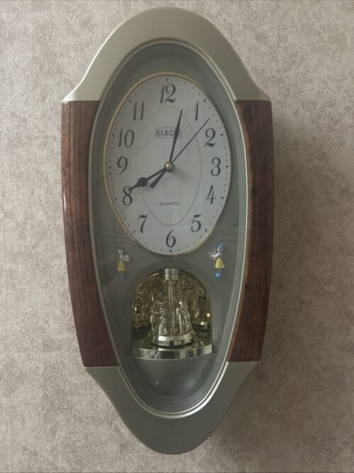 Rhythm Clocks Quartz Musical Motion Clock Eleco About 19 Inch. Wood Grain Rare