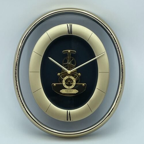 SEIKO Oval Wall Clock Gold Tone Skeleton Movement Roman Numerals Quartz Tested