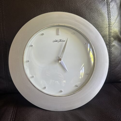 SETH THOMAS QUARTZ WALL CLOCK. Silver Color With White Background.