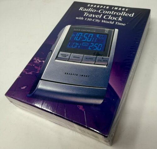 Sharper Image Radio Controlled Travel Clock 130 City World Time NIB sealed Alarm