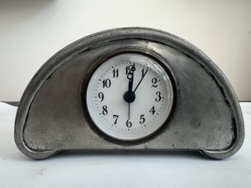 This is a Match Pewter Luna Alarm Clock.