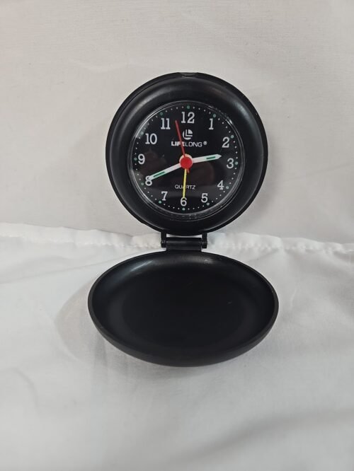 Used Lifelong-brand Folding Standup Travel Quartz Alarm Clock, takes AA battery
