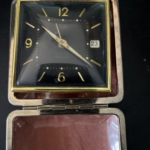 Vintage Elgin travel alarm clock with date