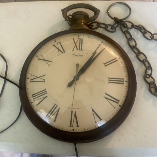 Vintage Pocket watch United wall Clock Model 40 apx 14"W 17"H working tested.