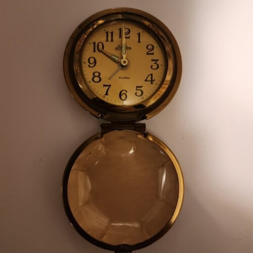 Vintage travel wind up alarm clock by Lyndon